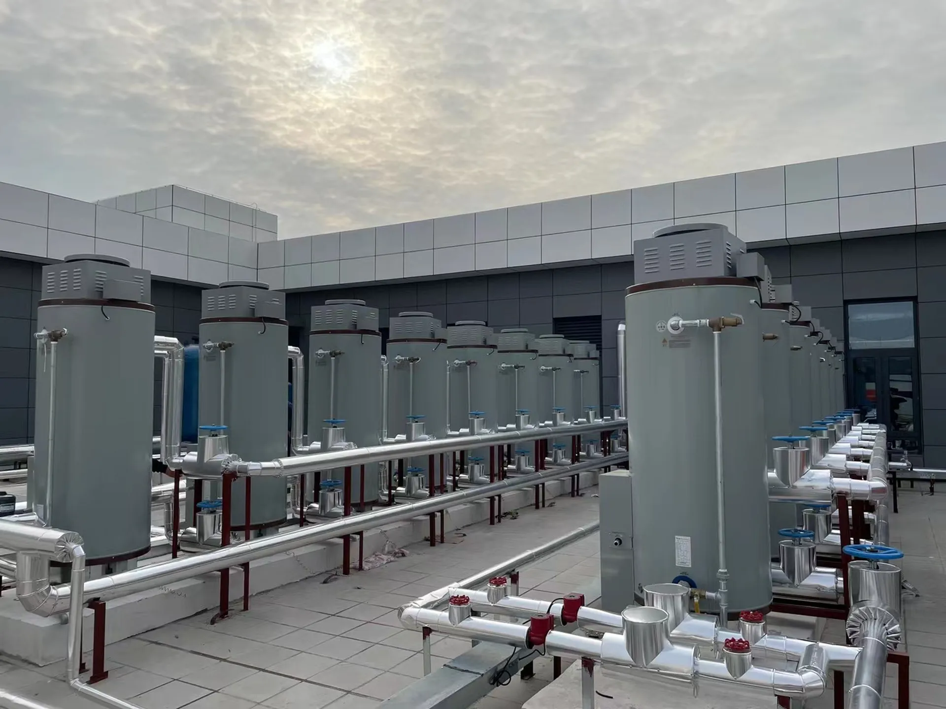 OTTMEL commercial gas water heaters installed on a school rooftop