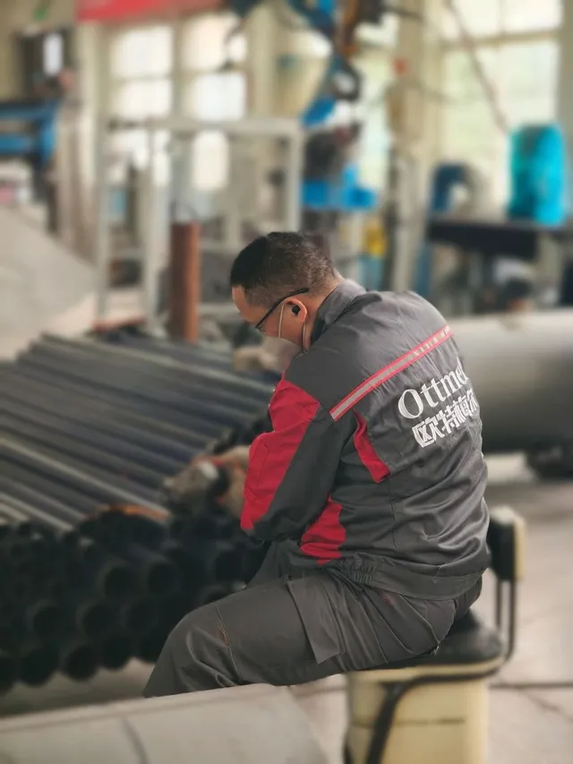 OTTMEL technician working on heat exchanger tubes